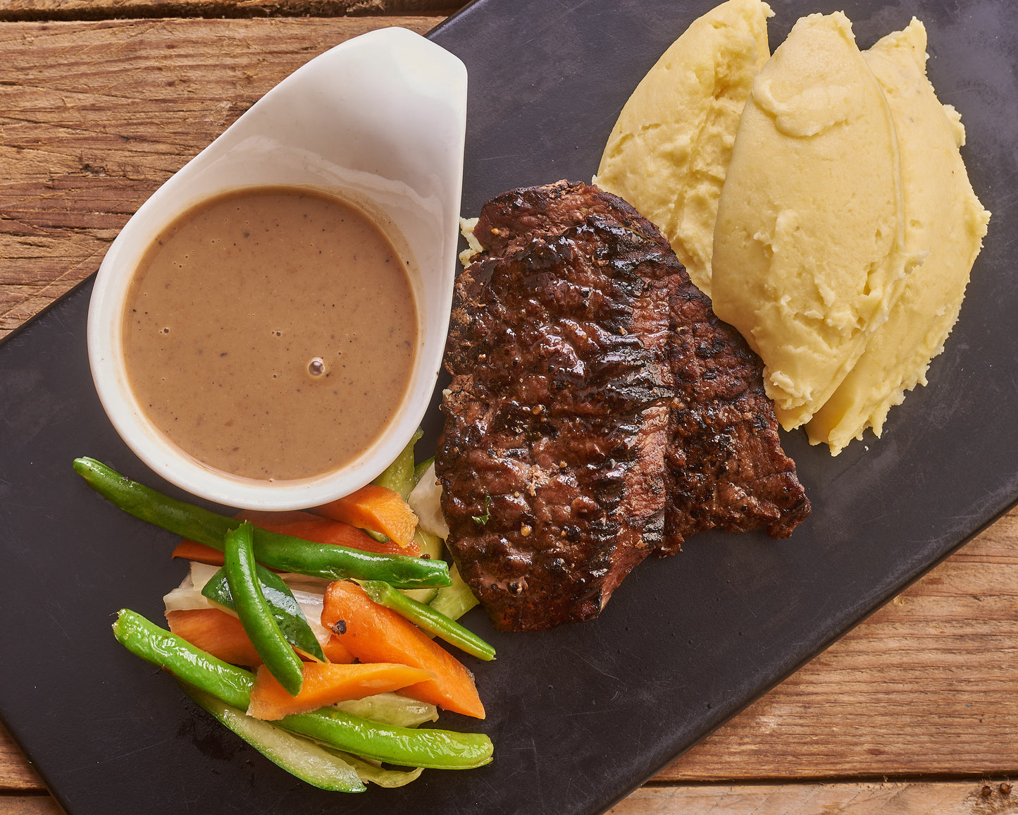 Grilled Steak with Mashed Potatoes and Vegetables